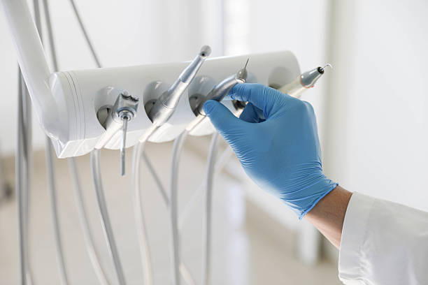 Professional Tooth Extraction technician working in Lewisville, WA